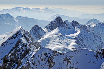 Scenic view of snowcapped mountains against sky