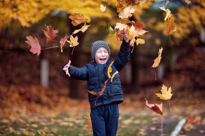 Baby walking, laughing, throwing leaves, autumn, yellow leaves, fly, fall, blue jacket, cute boy