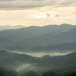 Scenic view of mountains against sky during sunset