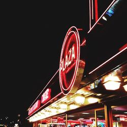 Low angle view of illuminated building at night