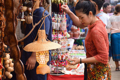 Group of people at market stall