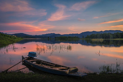 Scenic view of lake against sky during sunset