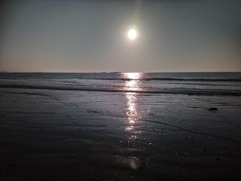 Scenic view of sea against sky at sunset