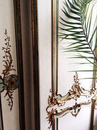 Close-up of statue against window