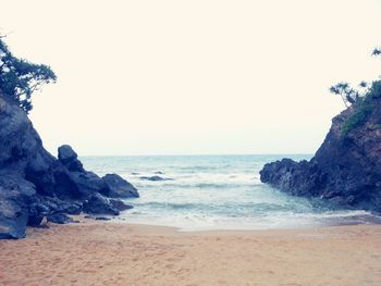 Scenic view of beach against clear sky