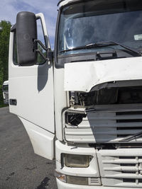 Close-up of car parked on street