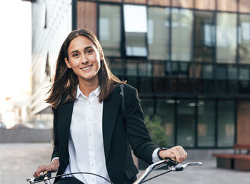 Portrait of young woman using mobile phone