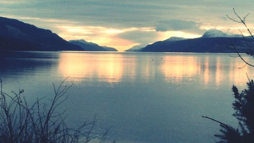 Scenic view of lake at sunset