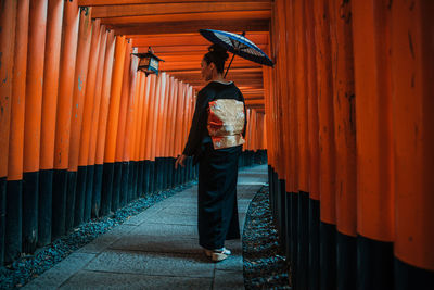 Full length of woman walking in temple