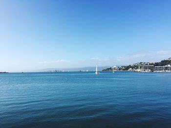 Scenic view of sea against blue sky