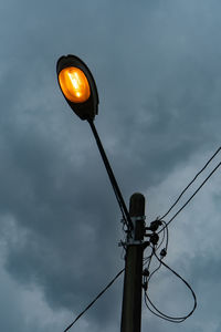 Low angle view of street light against sky