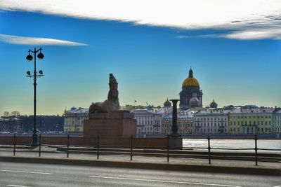 View of buildings against cloudy sky