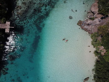 Aerial view of people swimming in sea