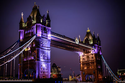 Illuminated tower bridge at night