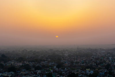 High angle view of townscape against sky during sunrise