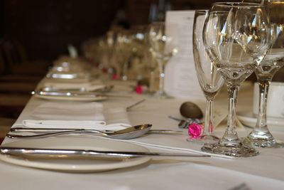 Empty wineglasses and plates on table