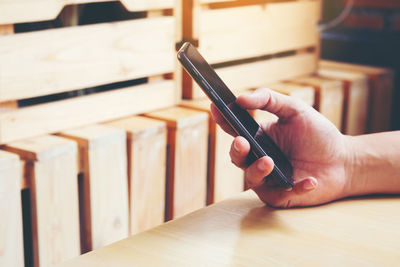 Close-up of man using mobile phone