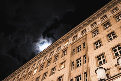 Low angle view of building against sky at night