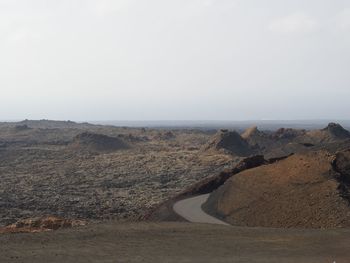 Scenic view of land against clear sky