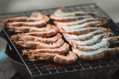 High angle view of meat on barbecue grill