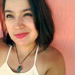 Close-up portrait of smiling young woman