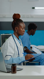 Female doctor sitting at clinic