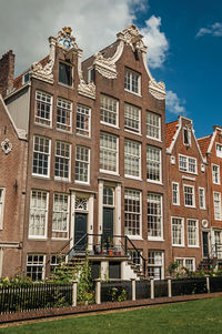 Row typical houses and garden at the begijnhof in amsterdam. the netherland capital full of canals.