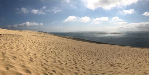 Scenic view of beach against sky