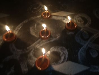 Close-up of lit tea light candles