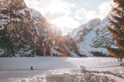 Scenic view of snow covered mountains against sky