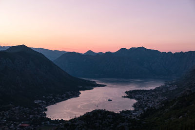 Scenic view of silhouette mountains against sky during sunset