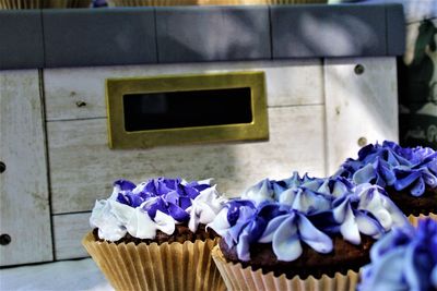 Close-up of purple roses on table