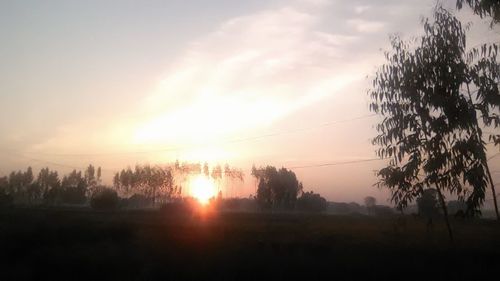 Scenic view of landscape at sunset