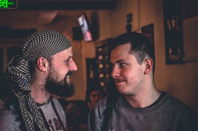 Close-up of happy friends at home