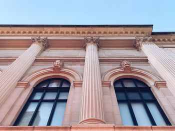 Low angle view of building against blue sky