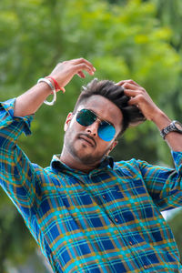 Portrait of young man wearing sunglasses