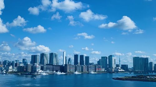 Scenic view of sea and buildings against sky