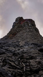 Low angle view of rock formations against sky