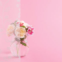 Cropped hand of bride holding bouquet