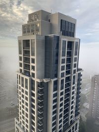 Modern buildings against sky in city