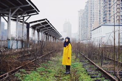 Full length of woman standing against sky