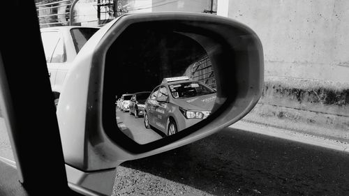 Reflection of car on side-view mirror