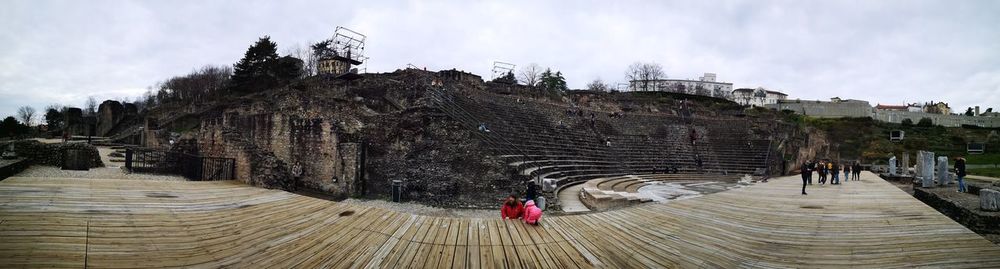 Panoramic view of people against sky