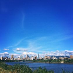 Cityscape against blue sky