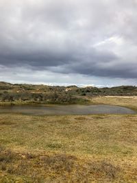 Scenic view of land against sky