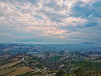 Scenic view of agricultural landscape against sky