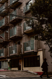 Rear view of man walking on street