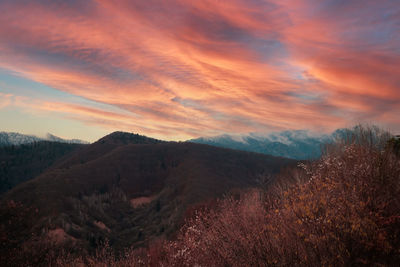 Scenic view of mountains against sky during sunset