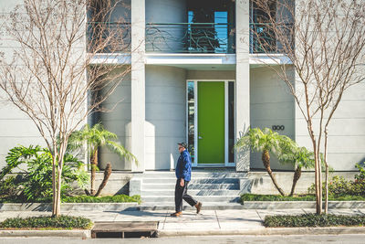 Man walking by building