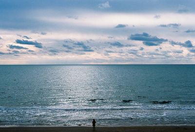 Scenic view of sea against cloudy sky